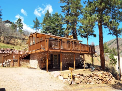 In the mountains and trees with views and wildlife.