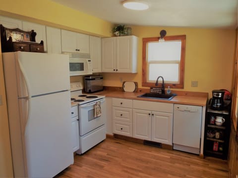 New, modern kitchen contains whatever you'll need.