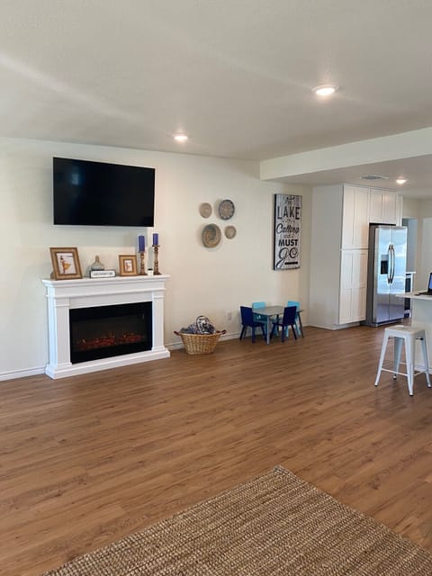 Other side of spacious family room - electric fireplace and tv.