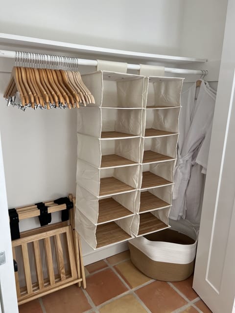 Bed 1 closet: luggage racks, plenty of hangers, hanging shelves, 2 robes.