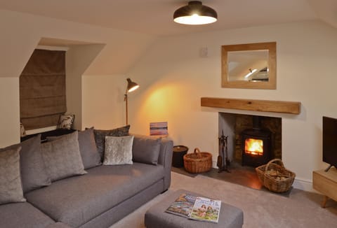 Cosy sitting room with wood stove
