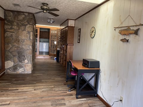 Front entrance with desk and WiFi printer 
Queen air bed, games in cabinet 