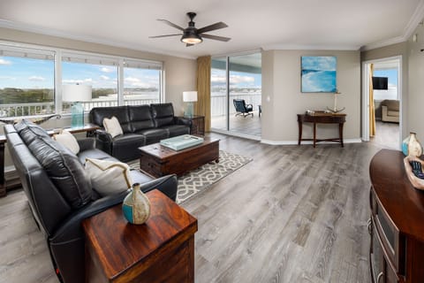Living Room: Bright space with stunning views, sleek furniture, and inviting coastal decor awaits!