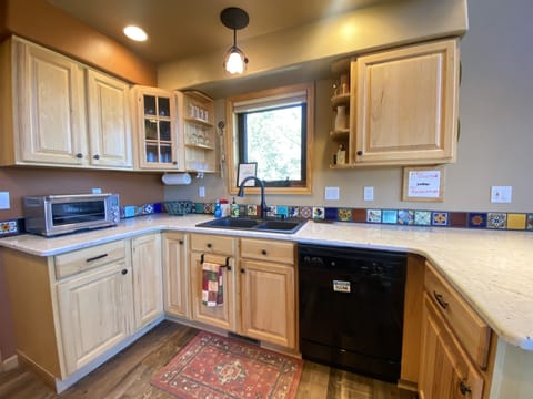 The full-service kitchen has all of the modern appliances and cooking gadgets needed to create your favorite gourmet meal.