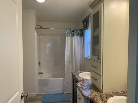 Combined shower/tub, hair dryer, towels, soap