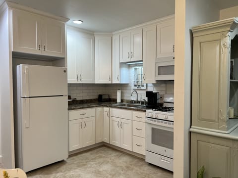 Sparkling white new kitchen has everything you need!