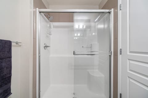 Combined shower/tub, hair dryer, towels, soap