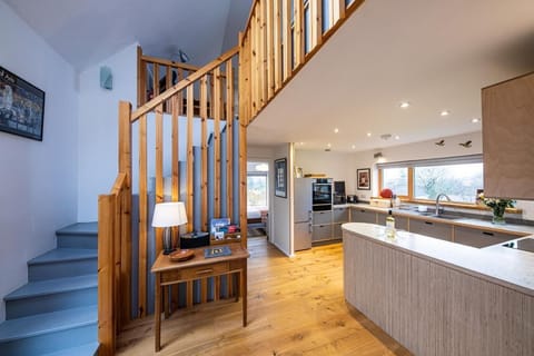 Hall/kitchen and staircase area.