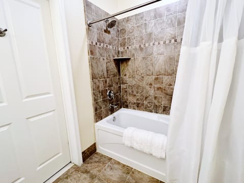 Combined shower/tub, hair dryer, towels, soap