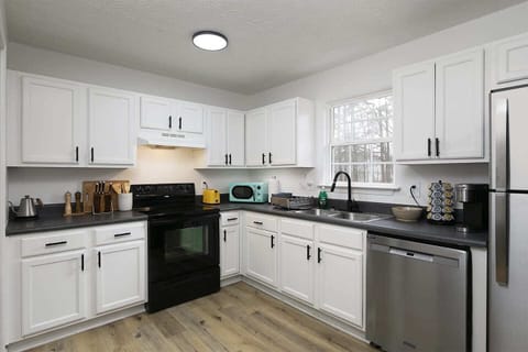 A fully stocked kitchen with all the cooking stuff you need to prepare great home cooked meals.