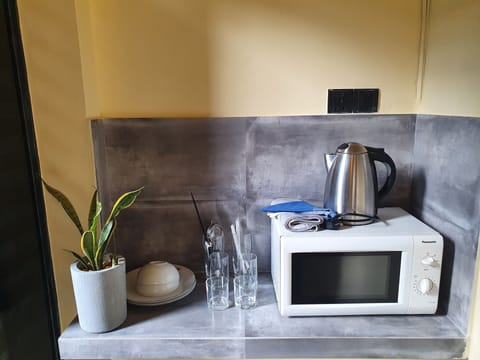 Fridge, microwave, electric kettle, dining tables