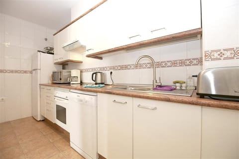 Typical kitchen in this apartment is fully fitted with all the appliances