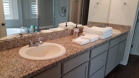 Combined shower/tub, hair dryer, towels, soap