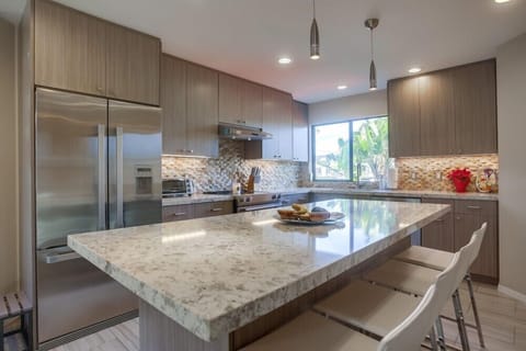 Upgraded appliances and a large kitchen island for cooking the perfect meal.