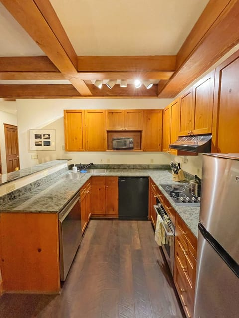 Large kitchen has new convection oven, dishwasher, and small fridge w/ice maker.