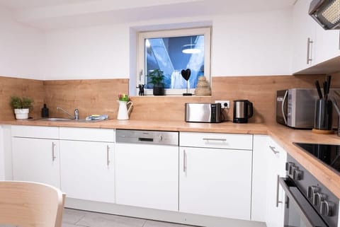 Dishwasher, Stove with oven, toaster, kettle, coffee machine