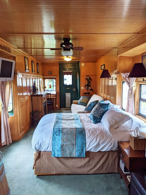 Grape Escape caboose has 1 queen bed and 1 full size sofa bed