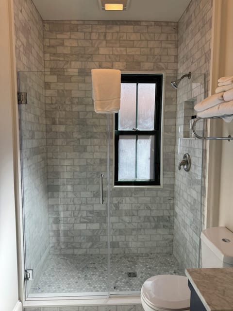 Combined shower/tub, hair dryer, towels, soap