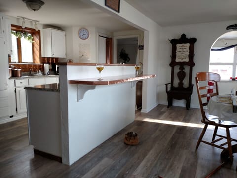 Kitchen island, opposite of the Copper bar is where the stove is located.