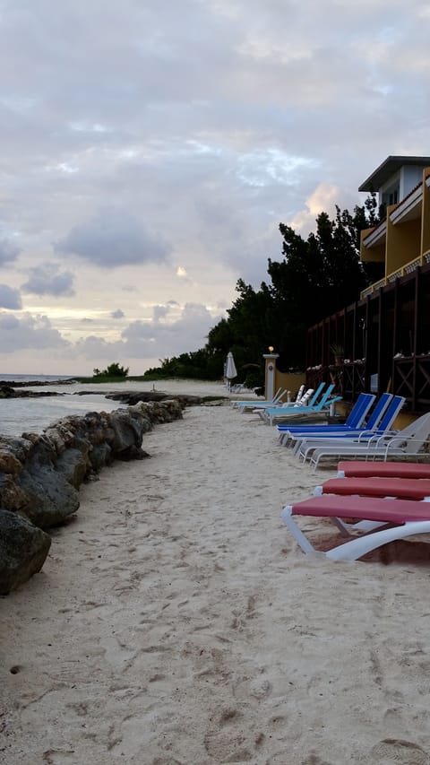 On the beach, sun loungers, beach towels