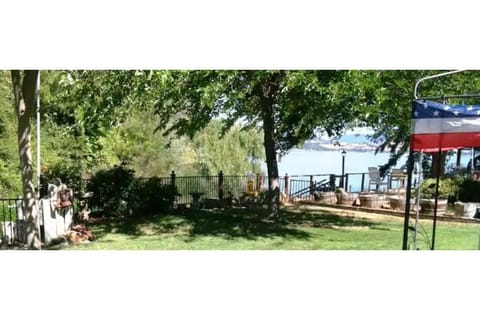 Your private, fenced backyard is right on the water with your fishing/boat dock.
