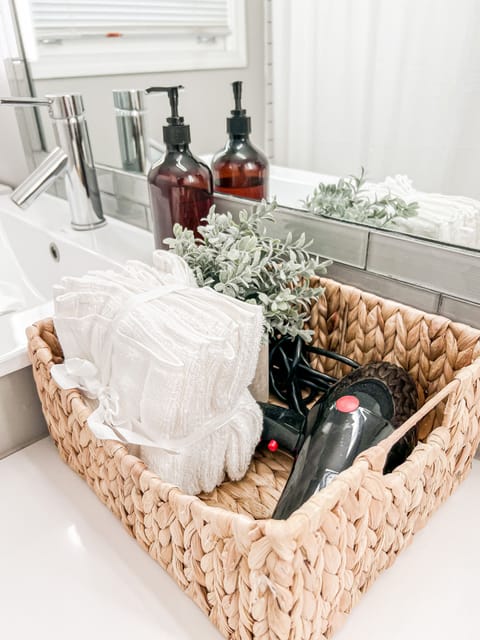 Combined shower/tub, hair dryer, towels, soap