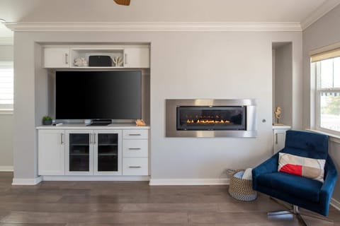 Do movie nights the right way—cozied up by the fireplace with endless options to watch on a 65" Samsung HDTV via Youtube TV.