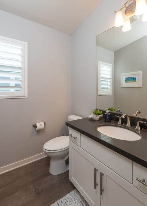 The powder room is located on the main living space just off of the kitchen.