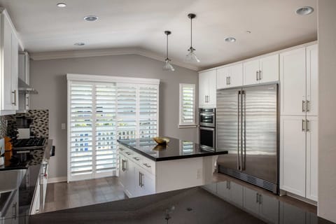 Built-in cabinetry and an oversized fridge and freezer add a luxurious feel to the kitchen.