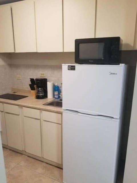 Fridge, microwave, stovetop, coffee/tea maker