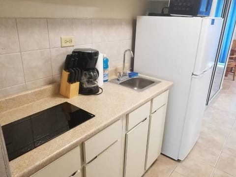 Fridge, microwave, stovetop, coffee/tea maker