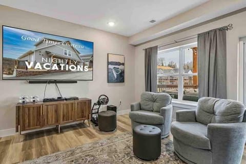 Another 86" TV, a PS4 with driving simulator, and plush cushy chairs!