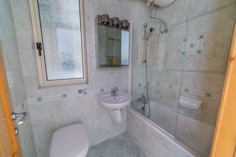 Combined shower/tub, hair dryer, towels, toilet paper