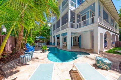 A heated pool, sun loungers