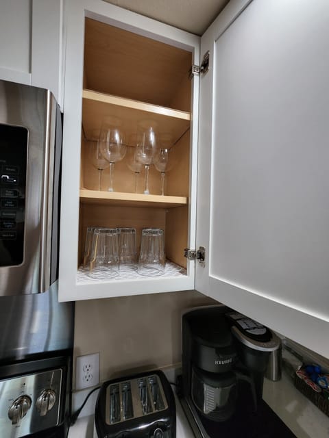 Fridge, microwave, stovetop, coffee/tea maker