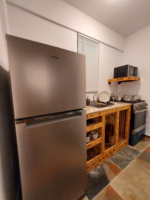 Fridge, microwave, stovetop, coffee/tea maker