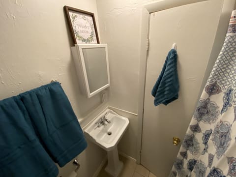 Combined shower/tub, hair dryer, towels, soap