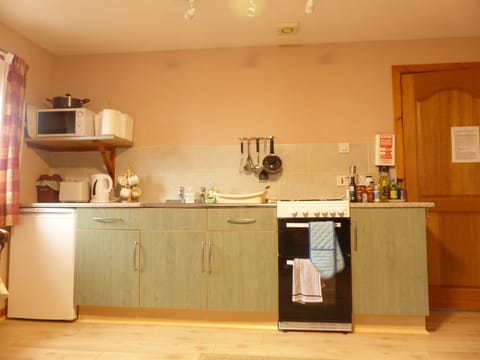 Kitchen area, also showing new wood flooring