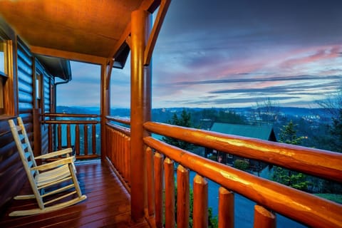 Unwind on the porch as you take in the beauty of a peaceful sunset.