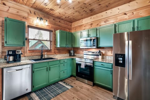 Kitchen equipped with all cooking essentials including an air fryer, crockpot, coffee maker that takes both grinds and k-cup pods