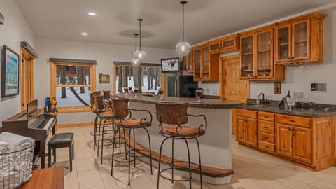 Wet bar with extra seating on lower level