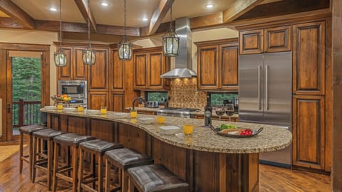 Main level gourmet kitchen with breakfast bar
