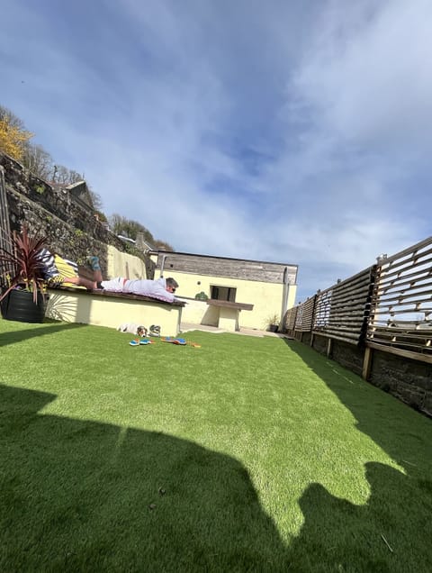 Bright courtyard garden area , with bbq and pizza oven