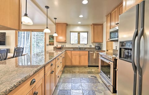 Kitchen fully stocked with dishware and cookware. Traditional drip coffee maker
