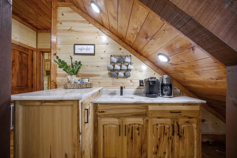 Under the right stairs you'll find a dedicated coffee bar