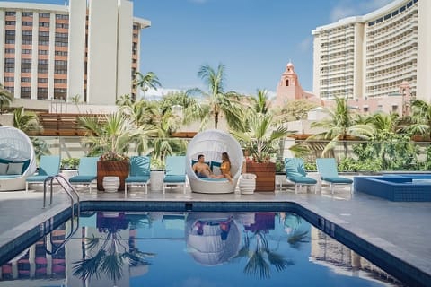 A rooftop pool, sun loungers