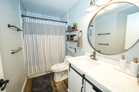 Combined shower/tub, hair dryer, towels, soap