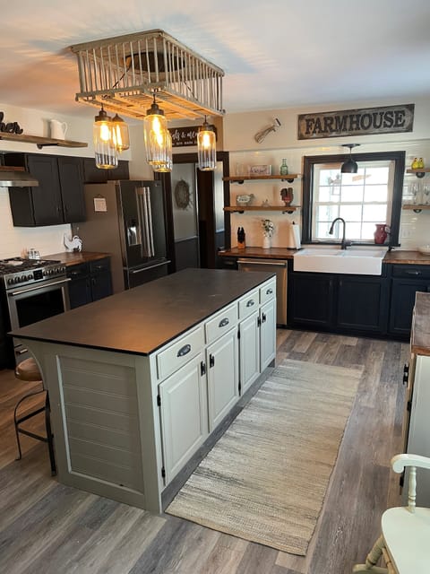 Large kitchen and fridge/freezer with ice maker in door and freezer.