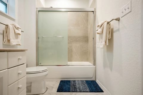 Combined shower/tub, hair dryer, towels, soap