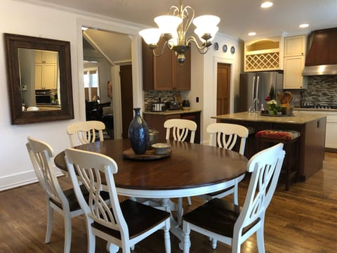 Dining table and kitchen with island